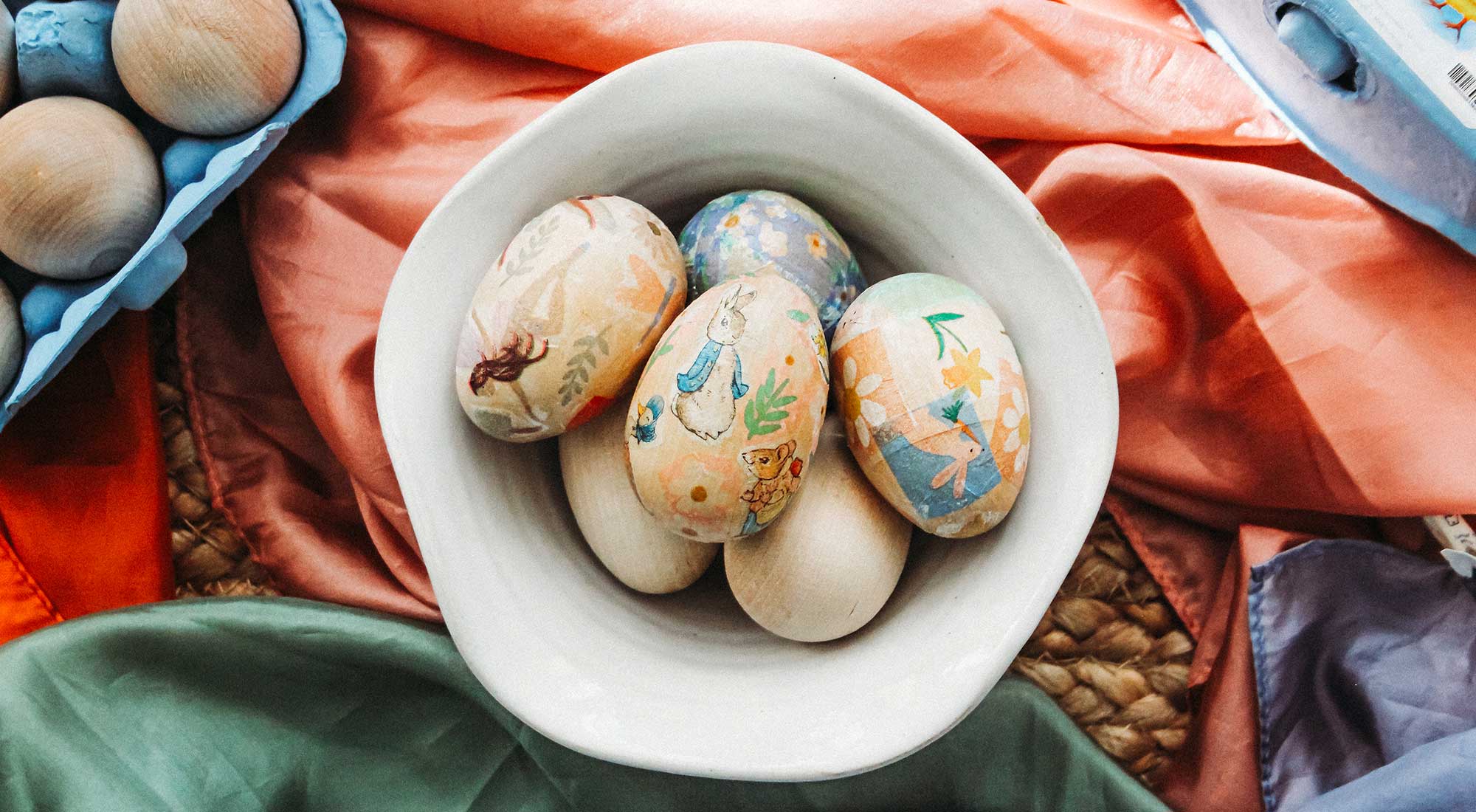 Découpage Wooden Easter Egg Craft sits on playsilks.