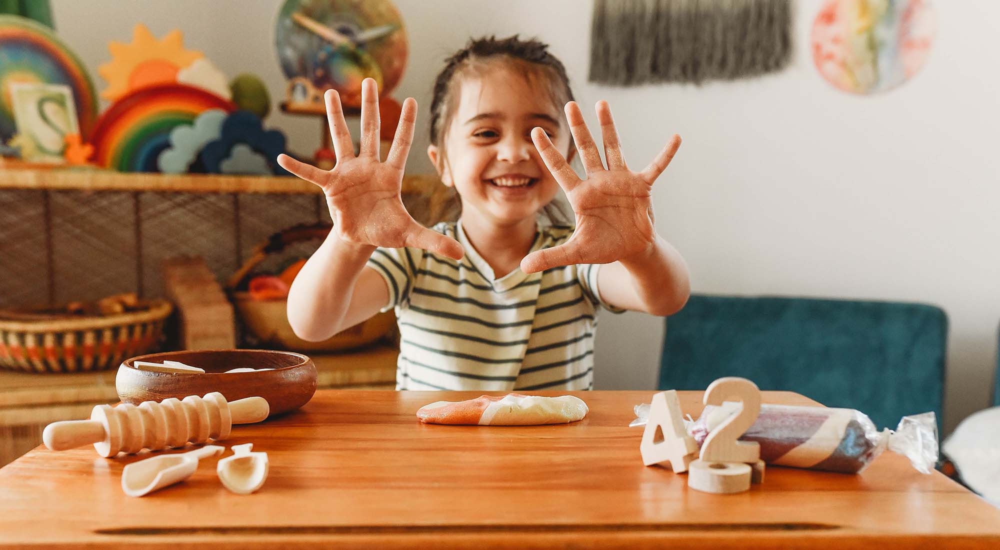 A boy is holding up 10 fingers