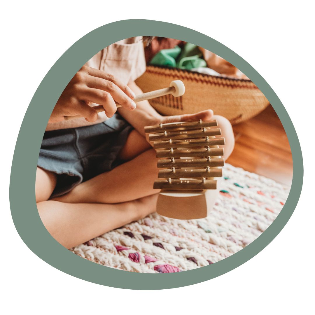 child playing xylophone