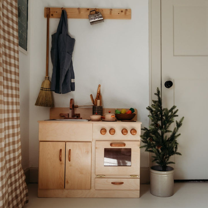 Bella Luna Wooden Kitchen in playroom with play food