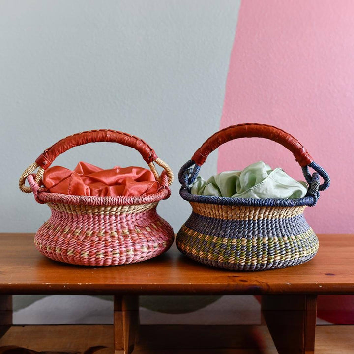 Bella Luna Toys Woods and Waters Swing Bolga Basket with Field of Flowers Basket on a wooden table