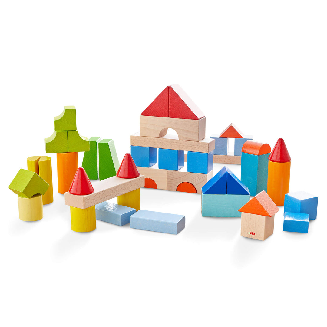 Colored Building Blocks 46 Piece Set with greens, blues, reds, oranges, and yellow wooden blocks stacked