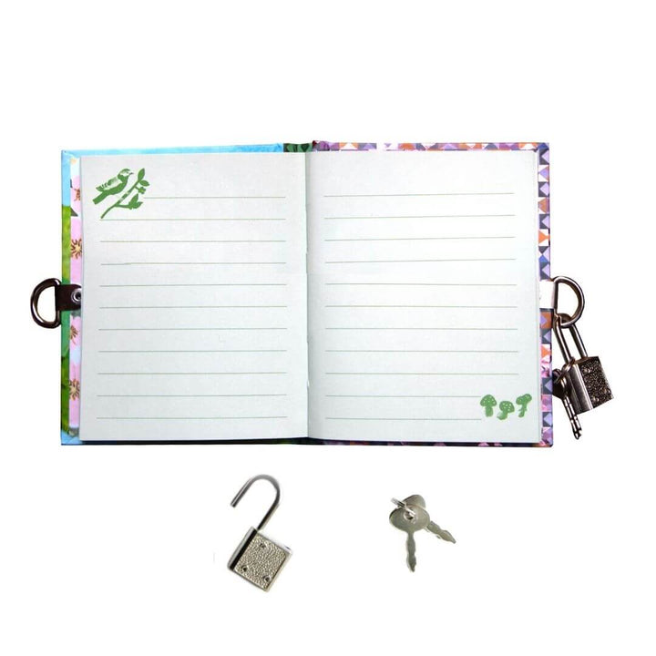 A pocket-sized eeBoo Very Small Fairy Journal opne to show the blank lined pages with whimsical fairy artwork by Gemma Koomen, gold foil accents, a metal lock, and two keys for secret writing.