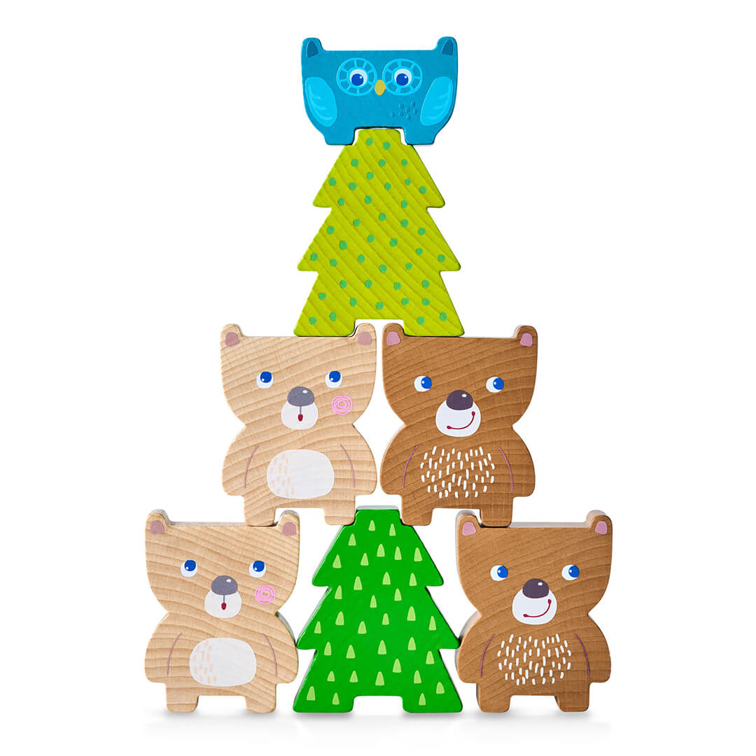 Forest Friends Stacking Toy features a blue owl on top, above three bear figures and a green Christmas tree.