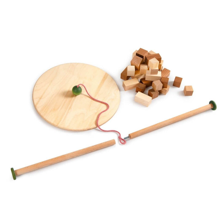 All the parts of the Grapat Wooden Pendulum Balance Board displayed to show how the rod is in two pieces.  A wooden handcrafted toy, made ins Spain for exploring balance, motion, and physics through open-ended play and creative experimentation.