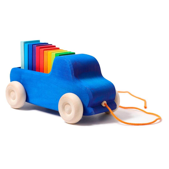 Grimm's Wooden Pull Along Truck - royal blue truck with natural wooden wheels and orange pull along string with 10 rainbow colored blocks in the truck bed