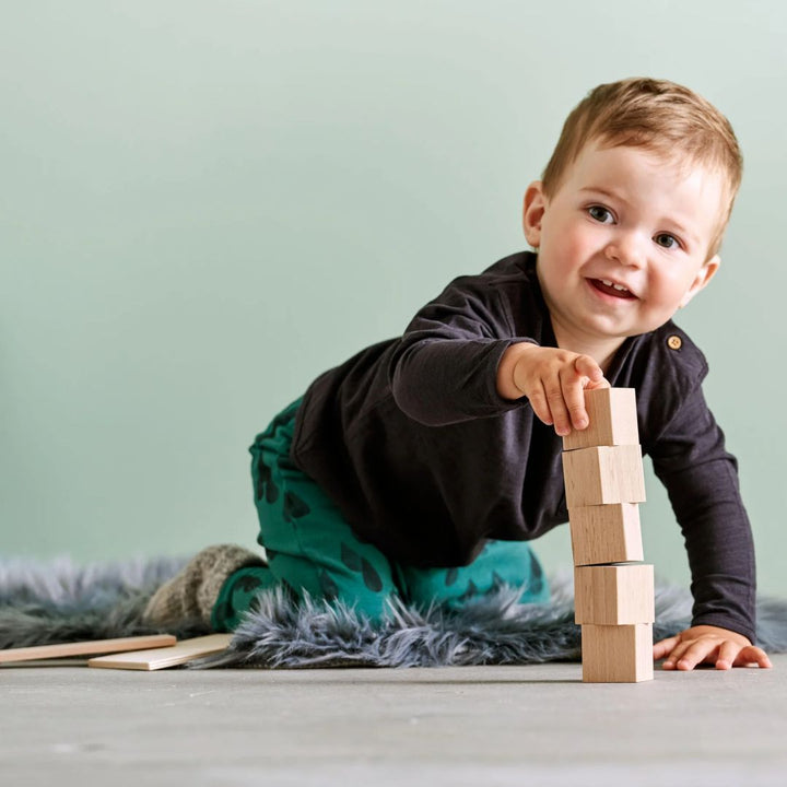 HABA Clever Up! Unit Wooden Block Building System 1.0 blocks stacked into a pyramid.