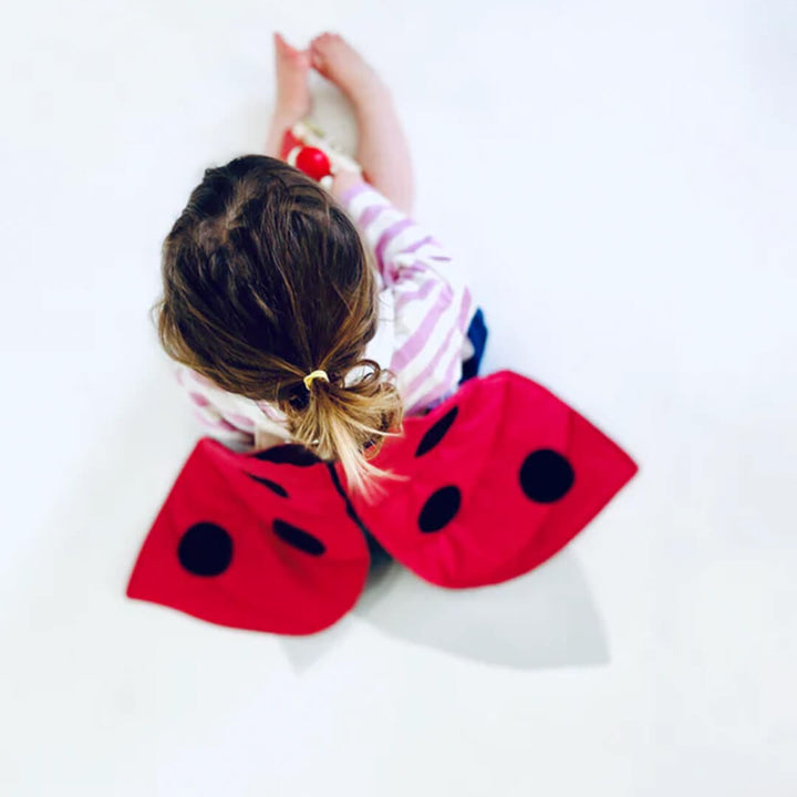 Young girl wearing Ladybug Wings Costume