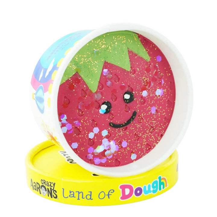 Strawberry Mary play dough cup from Land of Dough featuring a smiling strawberry.