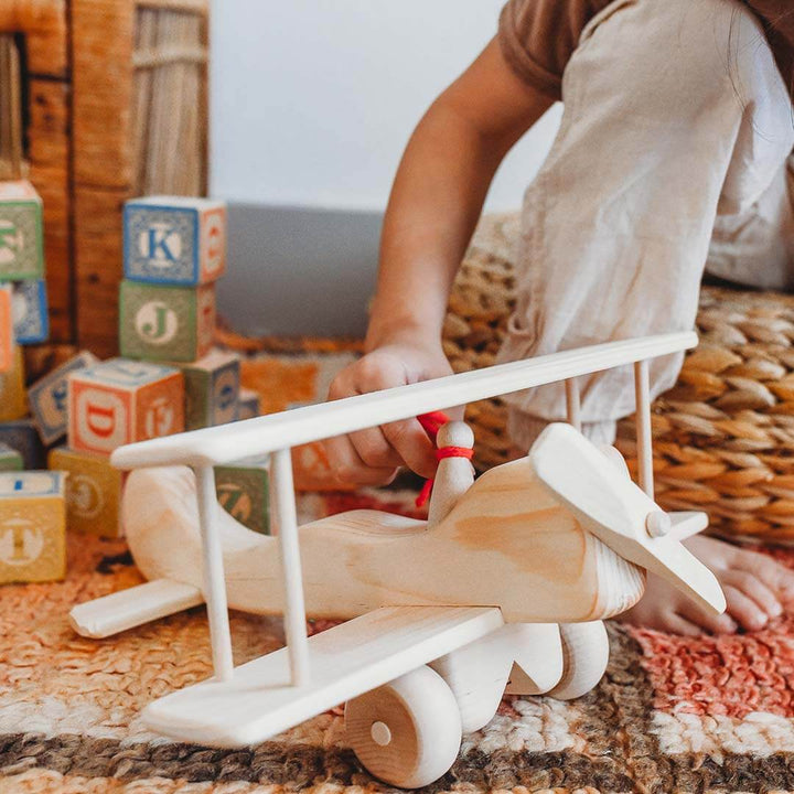 A natural wooden airplane 