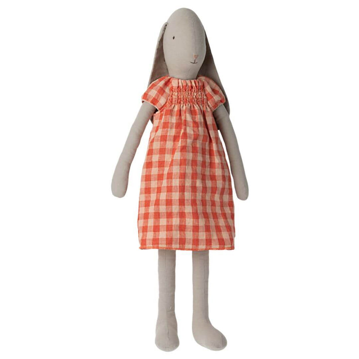 Maileg Bunny in Dress – Size 5. A soft, plush bunny with long floppy ears, wearing a charming orange and white gingham dress. Perfect for cuddles,Easter baket toys and first Easter.