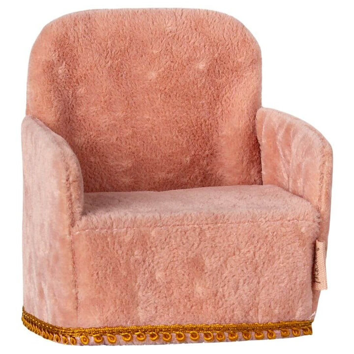 Maileg folding mouse sized arm chair in rose with gold accent on bottom.