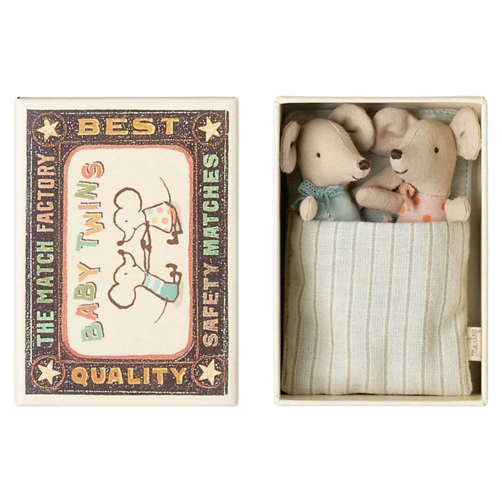 Two baby Maileg mice in their matchbox bed.