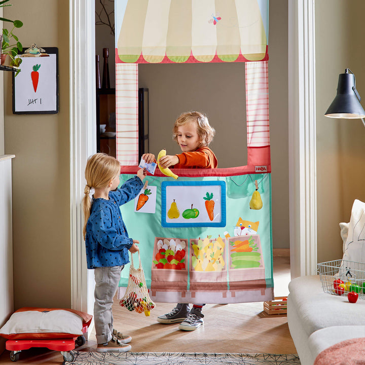 Kids playing in HABA Hanging Doorway Play Store