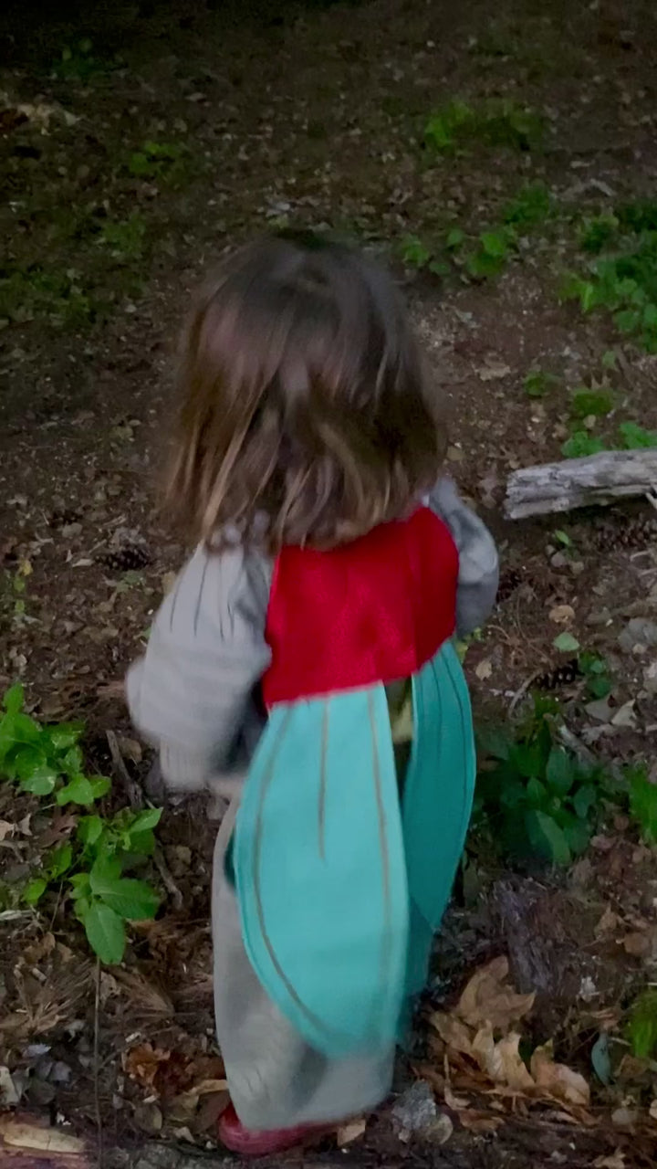 Video of child walking wearing firefly costume lighting up