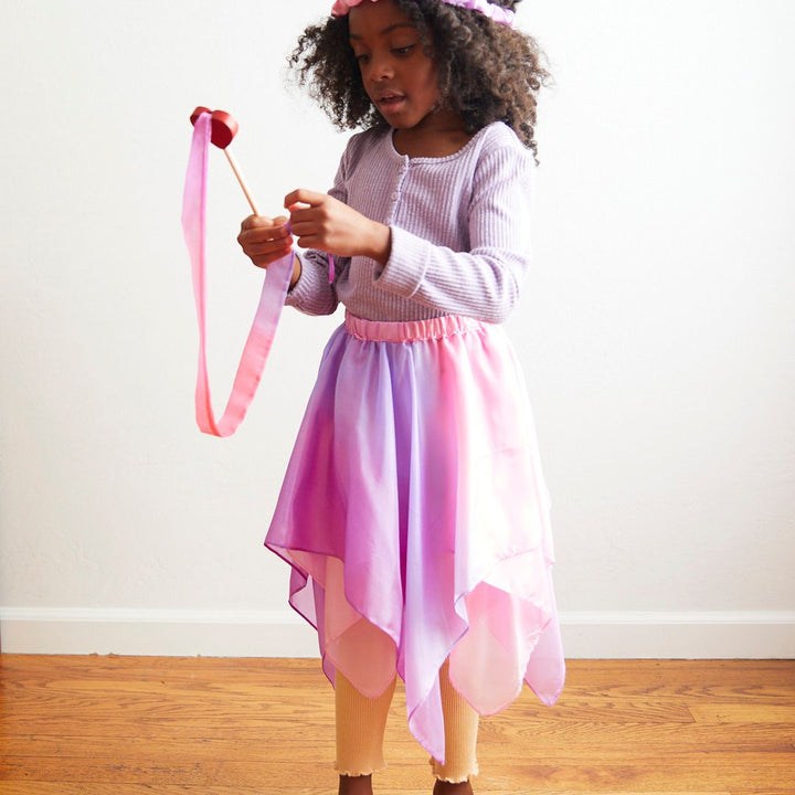 Child playing in Sarah's Silks skirt- Bella Luna Toys