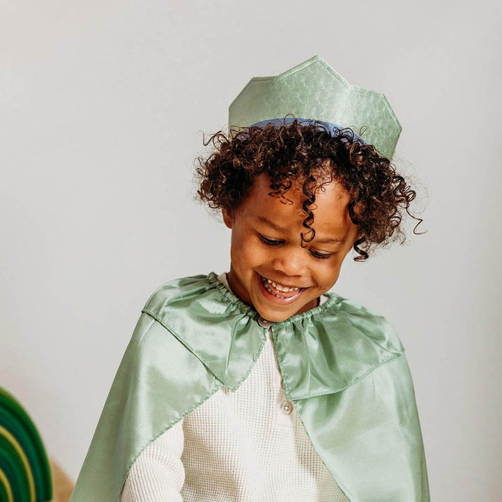 Child wearing Sarah's Silks Northern Coast Playsilk crown and cape in moss