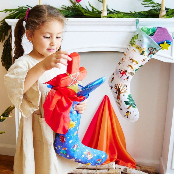 A child taking a silk sword out of the blue silk stocking.