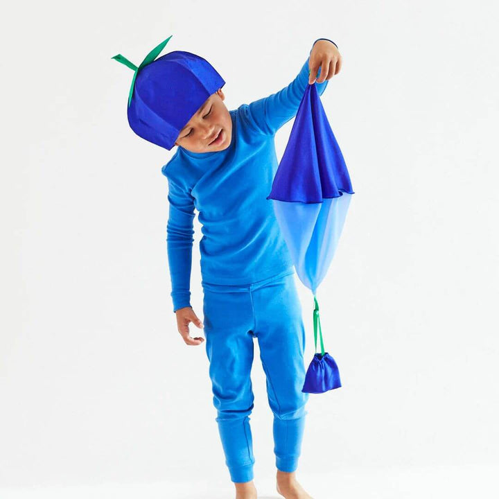 A child in a blueberry costume holds the silk blueberry parachute.