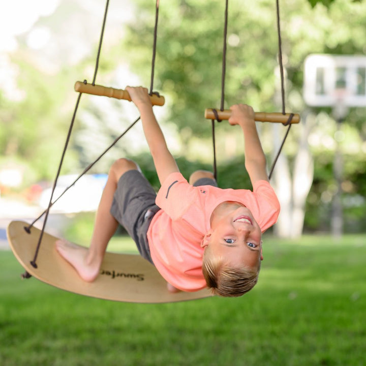 Swurfer-Child playing on wooden outdoor swing- Bella Luna Toys