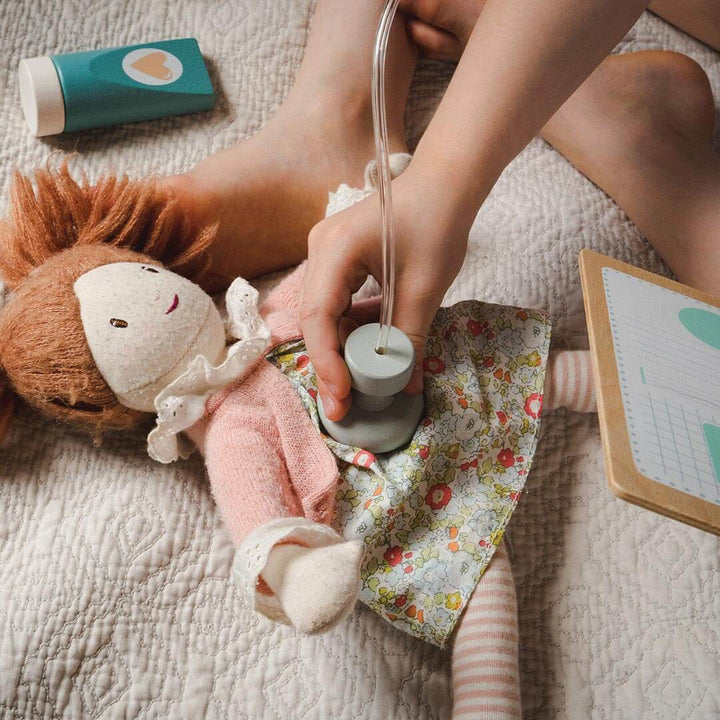 Kid using stethoscope from Tender Leaf Toys Doctor's Bag Wooden Play Set