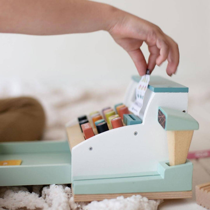 Pulling receipt from Tender Leaf Toys Wooden General Store Cash Register