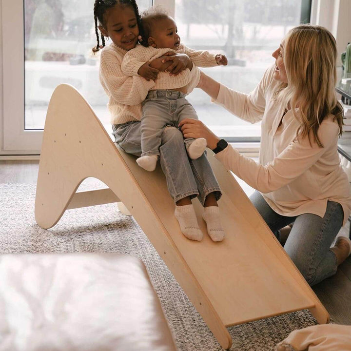 Kids sliding down Wooden Play Ramp Slide in Natural