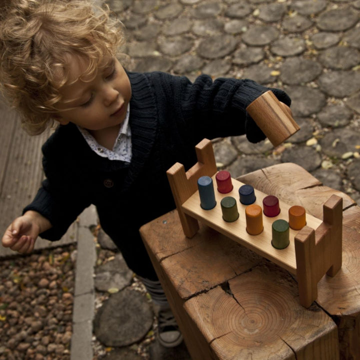 Wooden Story Rainbow Pound A Peg-Child playing with wooden peg toy- Bella Luna Toys