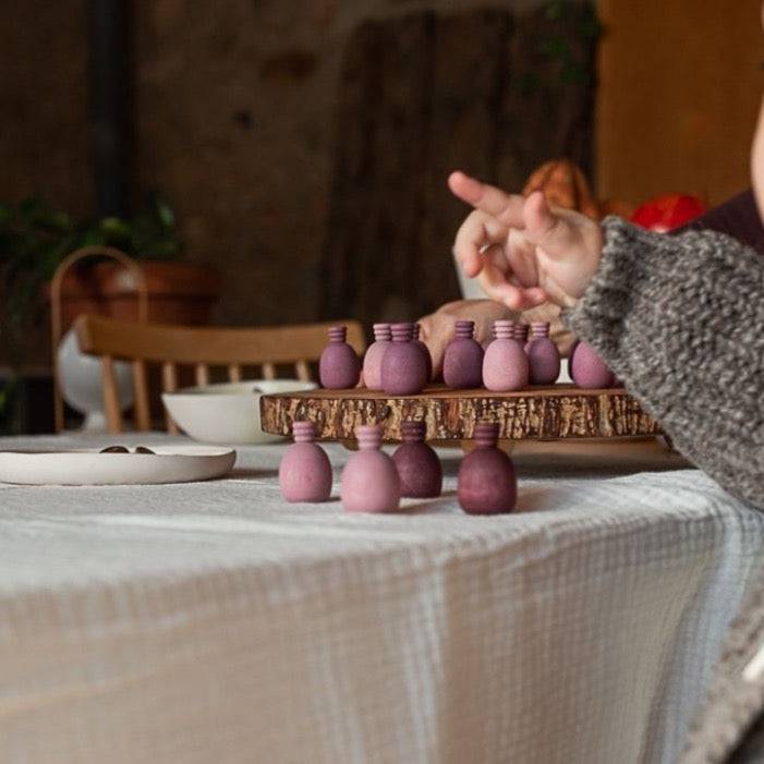 Child pointing near Grapat Wooden Mandala Pineapples on table