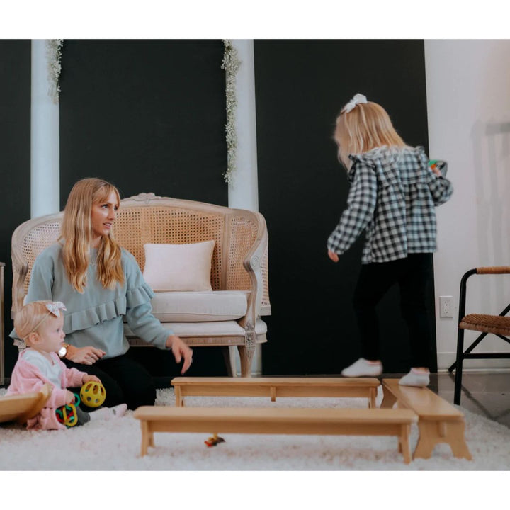 All Circles- Wooden Toys- Child balancing on three wooden balance beams- Bella Luna Toys